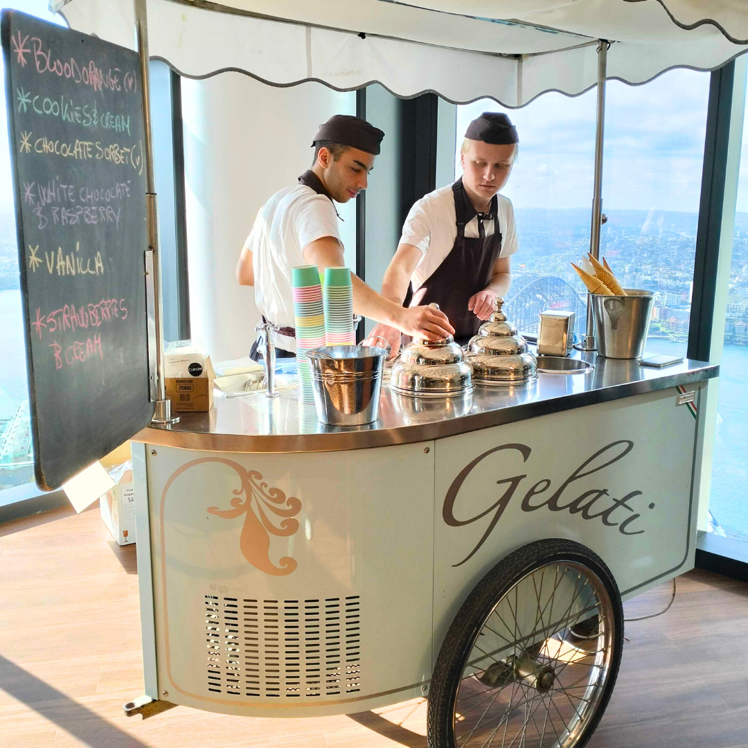Professional gelato cart with staff serving ice cream